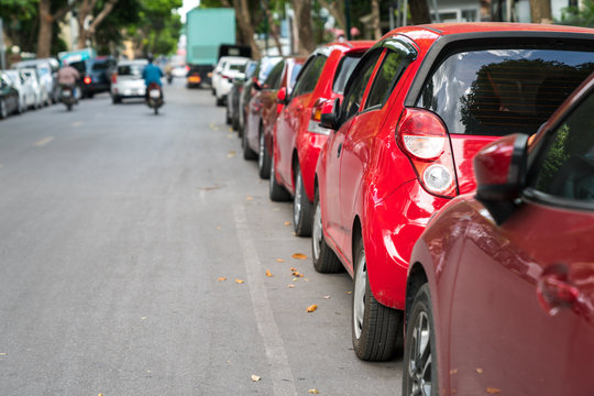 Parallel parking cars on urban street. Outdoor parking on road