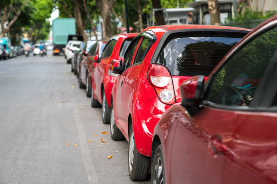 Parallel parking cars on urban street. Outdoor parking on road