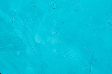cyan textured background. abstract blue stucco design. distressed scratched rough plaster backdrop. copy space concept