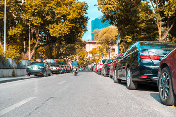 Parallel parking cars on urban street. Outdoor parking on road