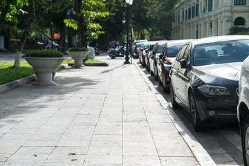Parallel parking cars on urban street. Outdoor parking on road