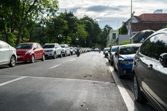Parallel parking cars on urban street. Outdoor parking on road