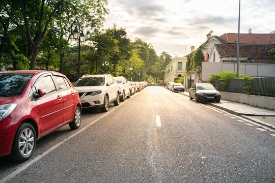 Parallel parking cars on urban street. Outdoor parking on road