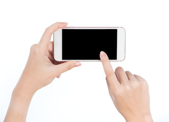 Concept of woman's hand holding a smartphone and pointing with figer isolated on white background, clipping path, blank for webpage or message.