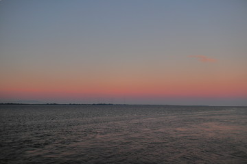 Fototapeta na wymiar Water, horizon and morning sky