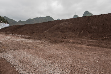 gravel road and mound in mining area