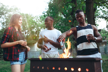 Group of friends making barbecue in the backyard. concept about good and positive mood with friends