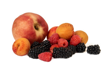 Peach, apricot, BlackBerry and raspberry isolated on white background