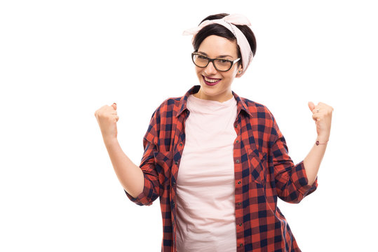 Young pretty pin-up girl wearing glasses showing winning gesture.