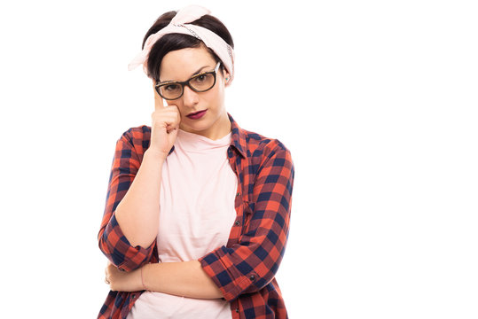 Young pretty pin-up girl wearing glasses showing thinking gesture.