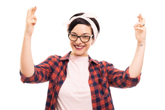 Young pretty pin-up girl wearing glasses showing double cross finger gesture.