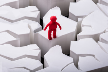 Human Figure Standing On Damaged White Surface
