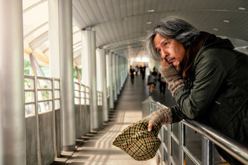 Lonely old man with gray hair look sad waiting for someone