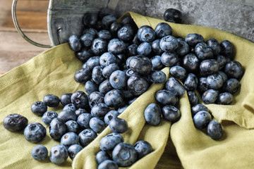 Ripe blueberries on table