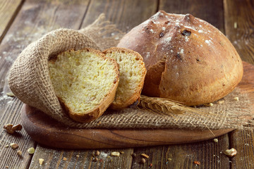baked bread on wooden table background