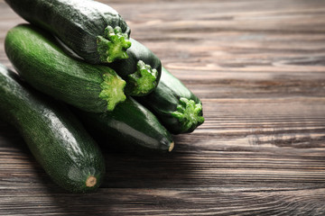 Ripe zucchinis on wooden table