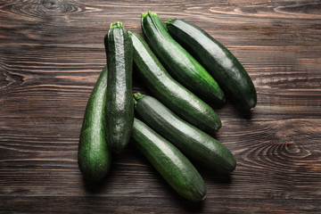Ripe zucchinis on wooden table