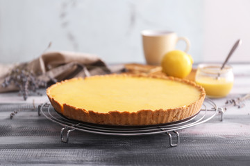 Tasty lemon pie on wooden table