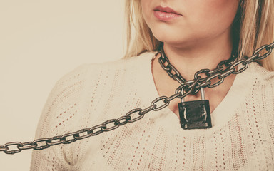 Woman having metal chain around neck