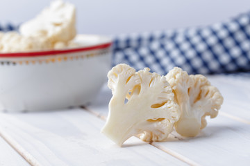 Organic cauliflower on wooden background