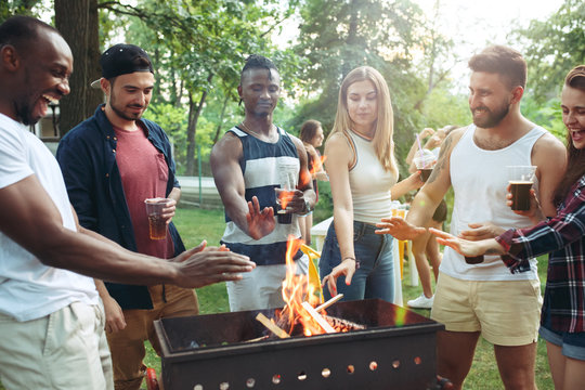 Group of friends making barbecue in the backyard. concept about good and positive mood with friends