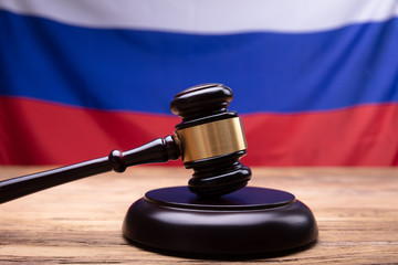 Close-up Of Judge Gavel On Sounding Block