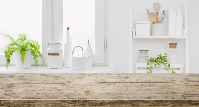 Vintage tabletop for product display with defocused modern kitchen background