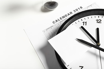 Fototapeta na wymiar Calendar and Clock on White Background