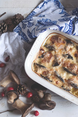 Delicious casserole with mushrooms and cheese, homemade dinner. Top view,