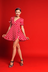 Portrait of a funny emotional young woman. Pin-up style.