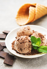 Chocolate ice cream on a stone background