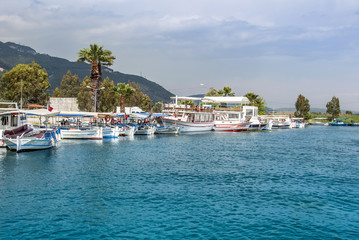 Fototapeta na wymiar Mugla, Turkey, 14 May 2012: Boats at Azmak Stream, Gokova Bay, Akyaka
