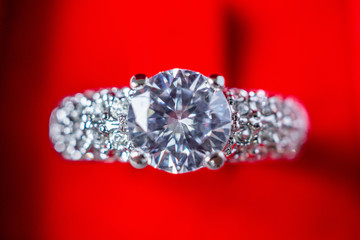 Fototapeta premium engagement wedding diamond ring in red jewelry gift box