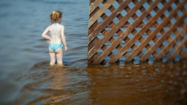 the girl runs around the river