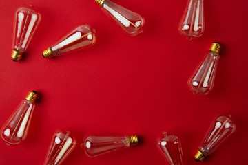 top view of vintage incandescent lamps on red surface