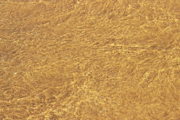 transparent water ripple on background of sand, texture, abstract, natural background