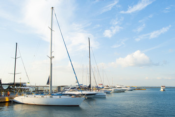 Fototapeta na wymiar Sea bay with yachts at sunset.