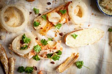 Smoked fish sandwich with onion rings
