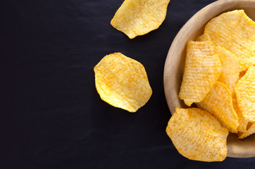 Potato chips on table background