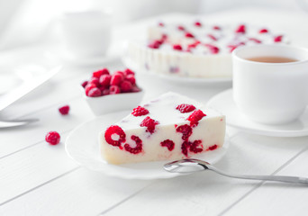 Panna cotta raspberries on a wooden table