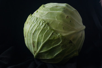 Fototapeta premium Cabbage vegetables on black ground