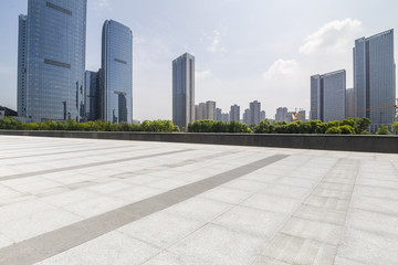 Panoramic skyline and modern business office buildings with empty road,empty concrete square floor