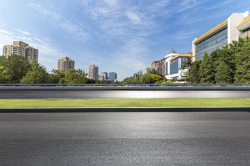 Panoramic skyline and modern business office buildings with empty road,empty concrete square floor