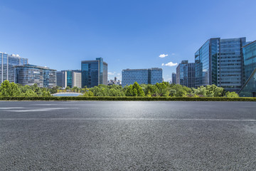 Panoramic skyline and modern business office buildings with empty road,empty concrete square floor