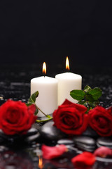 Fototapeta na wymiar Still life with red rose ,petals with candle and therapy stones 