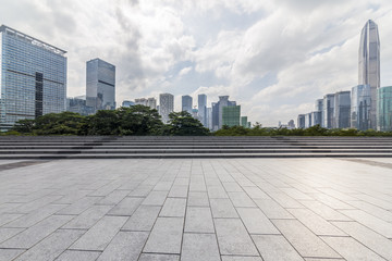 Panoramic skyline and modern business office buildings with empty road,empty concrete square floor