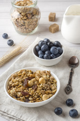 Oat flakes, granules and nuts muesli with blueberries. The concept of healthy food, Breakfast.