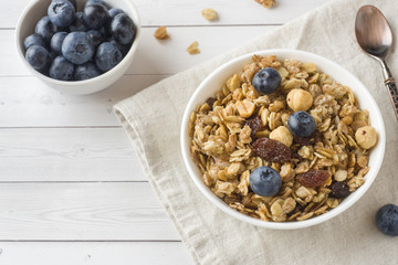 Oat flakes, granules and nuts muesli with blueberries. The concept of healthy food, Breakfast.