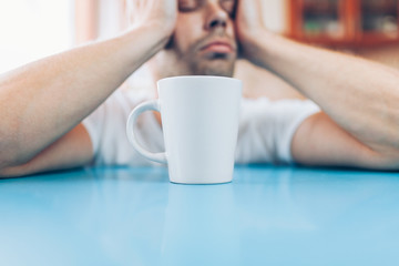 Man trying to wake up in the morning