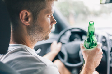 Drunk driver behind the steering wheel of a car